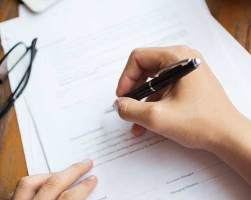 unrecognizable-man-filling-application-form-1-1-scaled